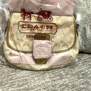 Brand new with tag Gold shimmering Coach purse